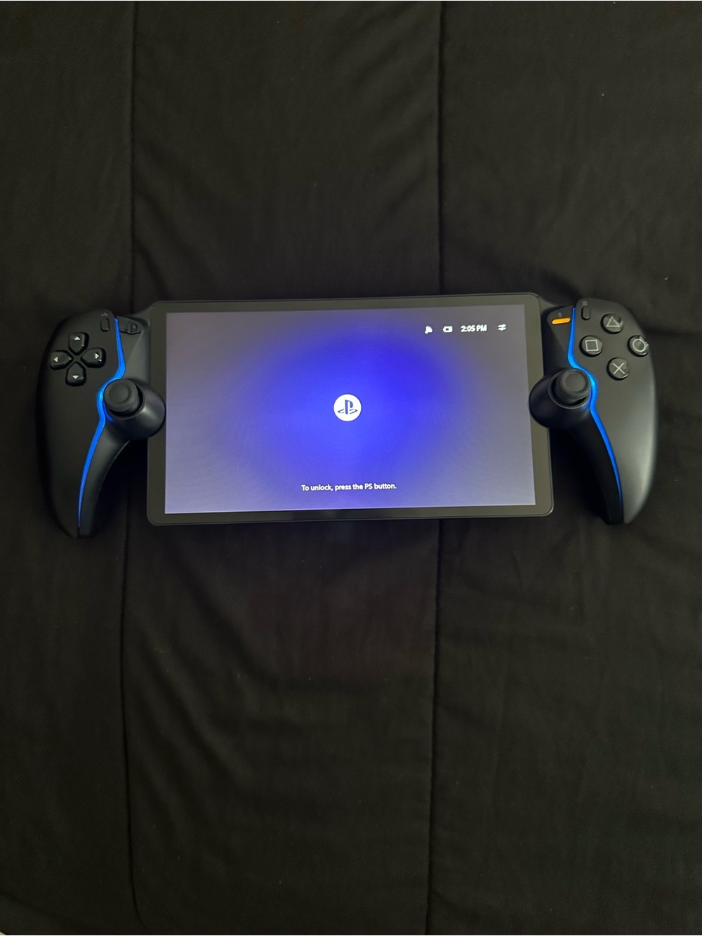 Sony PlayStation Handheld Console with Black and Blue Grip Controllers